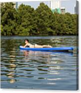 A Female Stand Up Paddle Board Lounges On The Crystal Clear Blue Waters Of On Lady Bird Lake In Austin, Texas- Stock Image Canvas Print