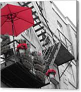 A Red Umbrella On A Balcony Canvas Print