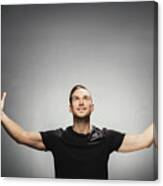 Attractive Man Smiling, Spreading His Arms. Canvas Print