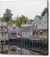 Backside Of Wooden Houses Over Water Canvas Print