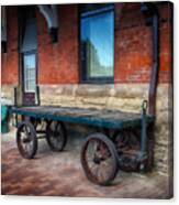 Baggage Cart Outside A Historical Train Staion Canvas Print