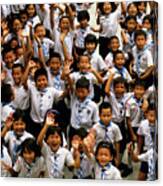 Bangkok School Children Jumping And Smiling At The Camera Canvas Print