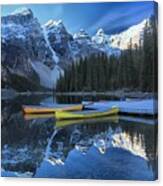 Canoes Under The Peaks Canvas Print