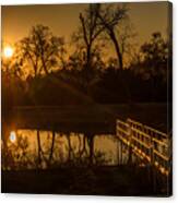 Evening Rays Highlight The Fishing Pier And Pond Reflections Canvas Print