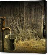 Fetching Water From The Old Pump Canvas Print