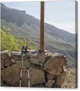 Hiking Poles Resting Near Sign Canvas Print