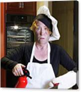 Kichen Disaster In Apron With Fire Extinguisher And Pan Canvas Print