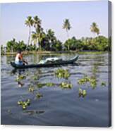 Man Boating On The Salt Water Lagoon In Alleppey In Kerala Canvas Print