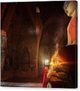 Monk In Bagan Old Town Pray A Buddha Statue With Candle Canvas Print