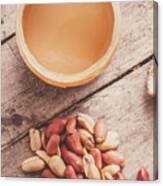 Peanut Butter Jar With Peanuts On Wooden Surface Canvas Print