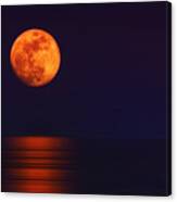 Super Moon Rising Over Water Canvas Print