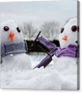 Two Cute Snowmen Wearing Scarfs And Twigs For Arms Canvas Print