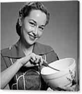 Woman Smiling With Mixing Bowl, C.1950s Canvas Print