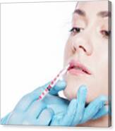 Young Woman Having Lip-plumping Injections. Canvas Print
