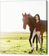 Young Woman Standing Next To Her Black Horse Canvas Print