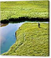 Two Young Men Hike Through A Grassy #1 Canvas Print
