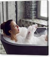 Sexy Young Beautiful Girl Is Lying In A Stone Gray Large Bathroom