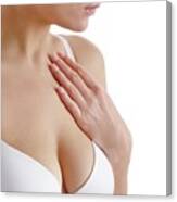 Woman touching upper chest - Stock Image - F021/2325 - Science Photo Library