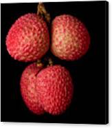 A Bunch Of Lychees Against A Black Canvas Print