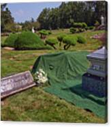 A Casket With Flowers Sits Beside A Gravesite Ready For Burial. Canvas Print