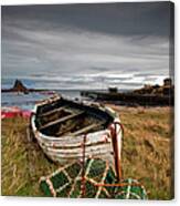 A Weathered Boat And Fishing Equipment Canvas Print