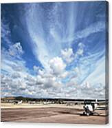 Airport Cloudscape And Light Planes Canvas Print