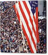 American Flag Hanging Over Crowd Canvas Print