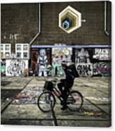 Bike Riding By Street Artist Canvas Print