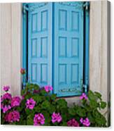 Blue Shutters And Geraniums Blooming Canvas Print