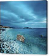 Blue Water With Blue Sky And Pebbles Canvas Print