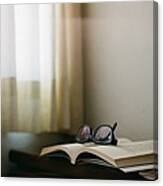 Book With Glasses And Window Curtain Canvas Print