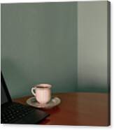 Coffee Cup And A Tablet On A Corner Table. Conceptual Image Canvas Print