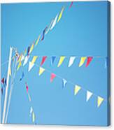 Colorful Flags Above Blue Sky Canvas Print