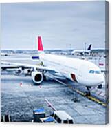 Commercial Jet At Gate Canvas Print