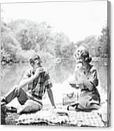 Couple Seated On Checkered Tablecloth Canvas Print