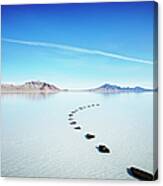 Curved Path Of Stones In Calm Lake Canvas Print
