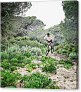 Cycling Over Rugged Terrain Canvas Print