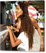 Family Buying Food While Standing In Amusement Park Canvas Print