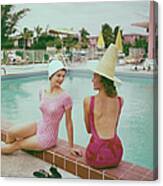 Fashionable Women Lounging At Poolside Canvas Print