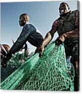 Fishermen Pulling In Net In Water Canvas Print