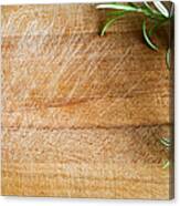 Fresh Rosemary On A Wood Chopping Board Canvas Print