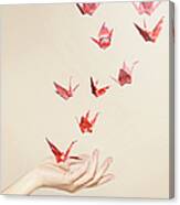 Group Of Red Origami Cranes Flying Away Canvas Print