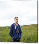 Guy In A Blue Jacket With A Camera In The Middle Of The Mountains Canvas Print
