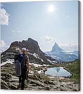 Hiker In The Swiss Alps Near Canvas Print