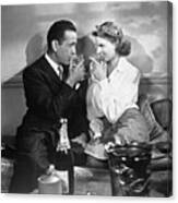 Humohrey Bogart And Ingrid Bergman Toasting With Drinks In Hand In casablanca Canvas Print