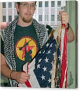 Man Holding Burned American Flag Canvas Print