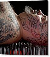 Man Lying On A Bed Of Nails Canvas Print