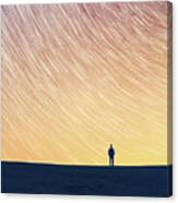 Man Standing On Hill, Star Trails Above Canvas Print