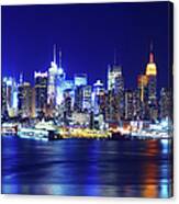 Midtown Manhattan At Night Across Canvas Print