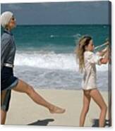 Model With Young Trumpeter On The Beach Canvas Print